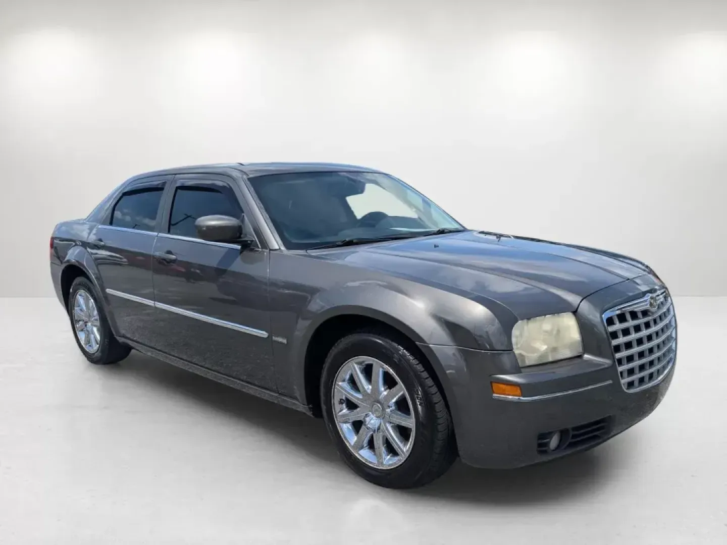 2009 /Dark slate gray Chrysler 300 Touring (2C3KA53V69H) with an Gas V6 3.5L/214 engine, 4-Speed Automatic transmission, located at 3959 U.S. 80 W, Phenix City, AL, 36870, (334) 297-4885, 32.469296, -85.135185 - Welcome to a new chapter in your driving experience! Whether you're navigating the bustling streets of Phenix City or embarking on a weekend getaway, the 2009 Chrysler 300 Touring is the perfect vehicle for those seeking a blend of comfort, style, and reliability. With its deep Dark Titanium Metalli - Photo#2