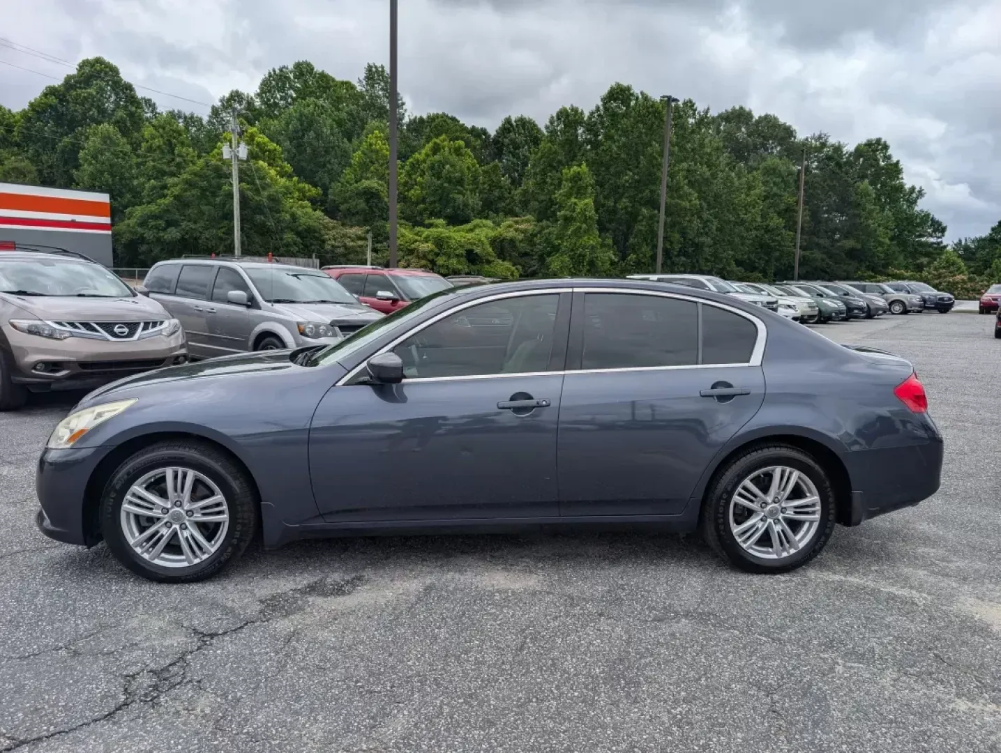 2012 /Stone Infiniti G25 Sedan x (JN1DV6AR8CM) with an Other engine, located at 5115 14th Ave., Columbus, GA, 31904, (706) 323-0345, 32.511494, -84.971046 - If you're looking for a stylish, dependable vehicle that fits seamlessly into an active lifestyle, look no further than this 2012 Infiniti G25 Sedan, now available at Gils Auto - Columbus. With its elegant design and robust performance, this sedan is perfect for everything from daily commutes to wee - Photo#7