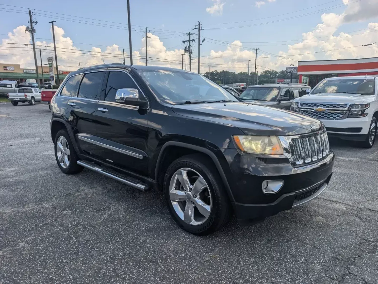 2012 /Black/New Saddle Jeep Grand Cherokee Overland Summit (1C4RJECT6CC) with an Other engine, located at 3959 U.S. 80 W, Phenix City, AL, 36870, (334) 297-4885, 32.469296, -85.135185 - **Conquer the Road with the 2012 Jeep Grand Cherokee Overland Summit! Ideal for Your Next Adventure!**<br /> <br /> Are you ready to elevate your driving experience? The 2012 Jeep Grand Cherokee Overland Summit is the perfect companion for those who crave adventure without sacrificing comfort. Wheth - Photo#2