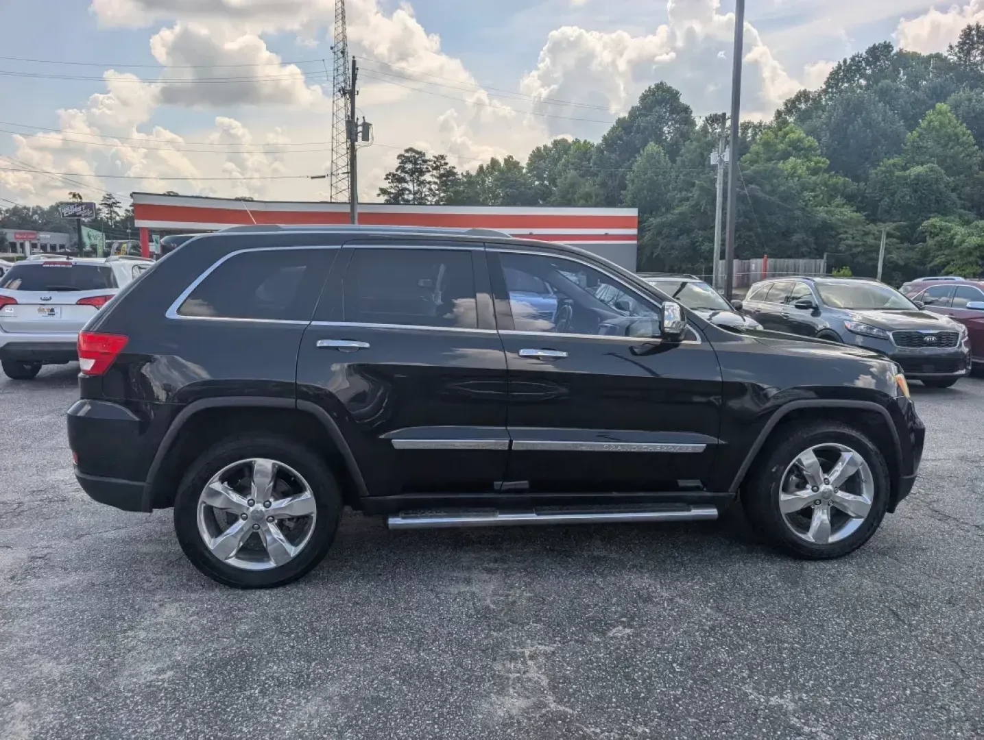 2012 /Black/New Saddle Jeep Grand Cherokee Overland Summit (1C4RJECT6CC) with an Other engine, located at 3959 U.S. 80 W, Phenix City, AL, 36870, (334) 297-4885, 32.469296, -85.135185 - **Conquer the Road with the 2012 Jeep Grand Cherokee Overland Summit! Ideal for Your Next Adventure!**<br /> <br /> Are you ready to elevate your driving experience? The 2012 Jeep Grand Cherokee Overland Summit is the perfect companion for those who crave adventure without sacrificing comfort. Wheth - Photo#3