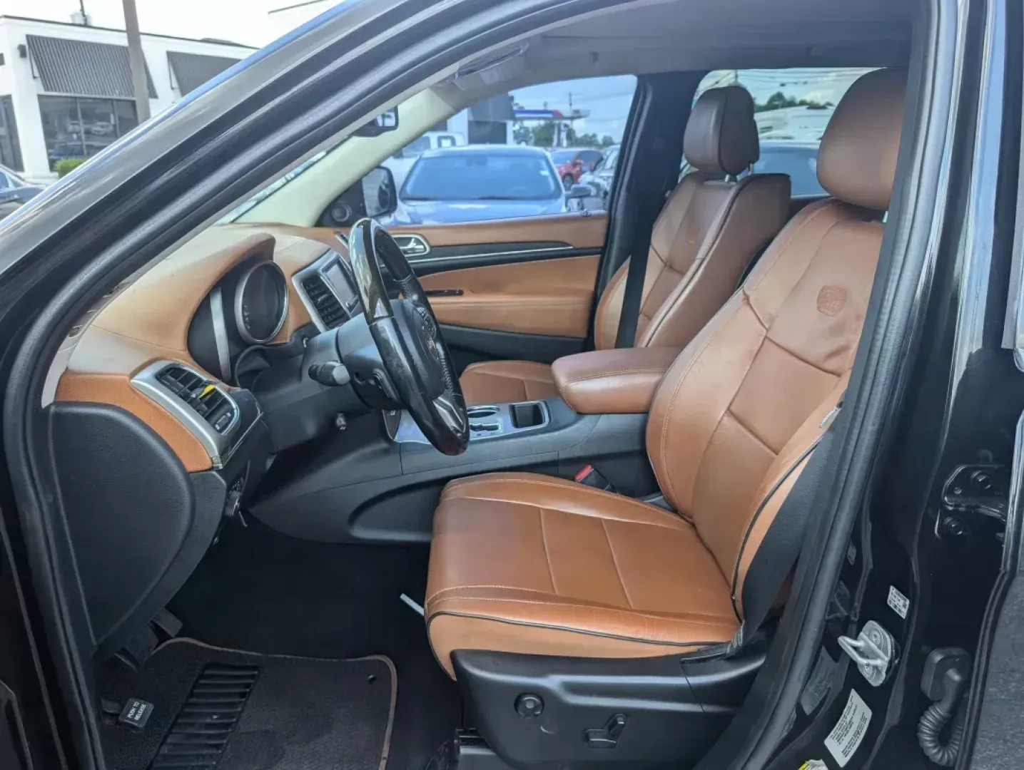 2012 /Black/New Saddle Jeep Grand Cherokee Overland Summit (1C4RJECT6CC) with an Other engine, located at 3959 U.S. 80 W, Phenix City, AL, 36870, (334) 297-4885, 32.469296, -85.135185 - **Conquer the Road with the 2012 Jeep Grand Cherokee Overland Summit! Ideal for Your Next Adventure!**<br /> <br /> Are you ready to elevate your driving experience? The 2012 Jeep Grand Cherokee Overland Summit is the perfect companion for those who crave adventure without sacrificing comfort. Wheth - Photo#9