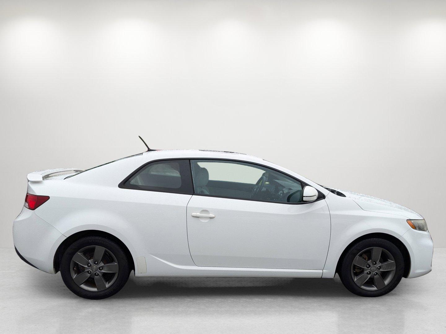 2012 /Stone Kia Forte Koup EX (KNAFU6A20C5) with an Gas I4 2.0L/122 engine, 6-Speed Automatic transmission, located at 1430 Gateway Drive, Opelika, AL, 36801, (334) 239-0944, 32.637871, -85.409790 - 2012 Kia Forte Koup EX - Photo#3