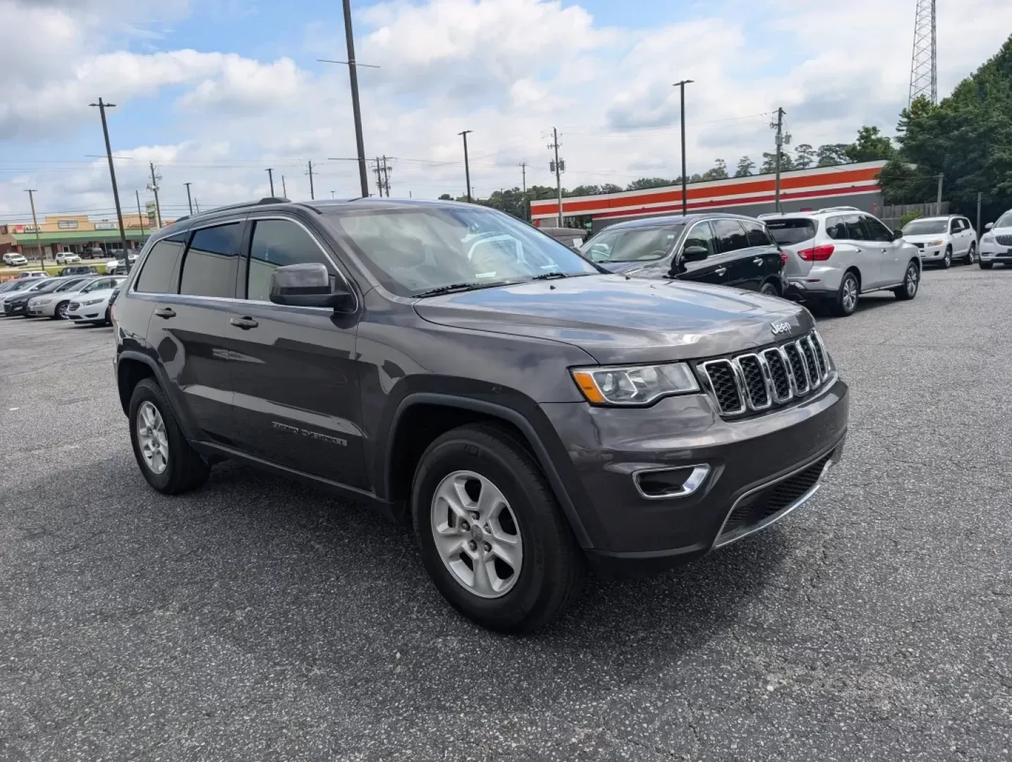 2017 /Black Jeep Grand Cherokee Laredo (1C4RJEAG0HC) with an Other engine, located at 3959 U.S. 80 W, Phenix City, AL, 36870, (334) 297-4885, 32.469296, -85.135185 - Experience the ultimate blend of comfort and capability in this 2017 Jeep Grand Cherokee Laredo, now available at Gils Auto in Phenix City, AL. Whether you're commuting through the bustling streets of downtown, tackling weekend getaways, or embarking on family road trips, this SUV is designed to ele - Photo#2