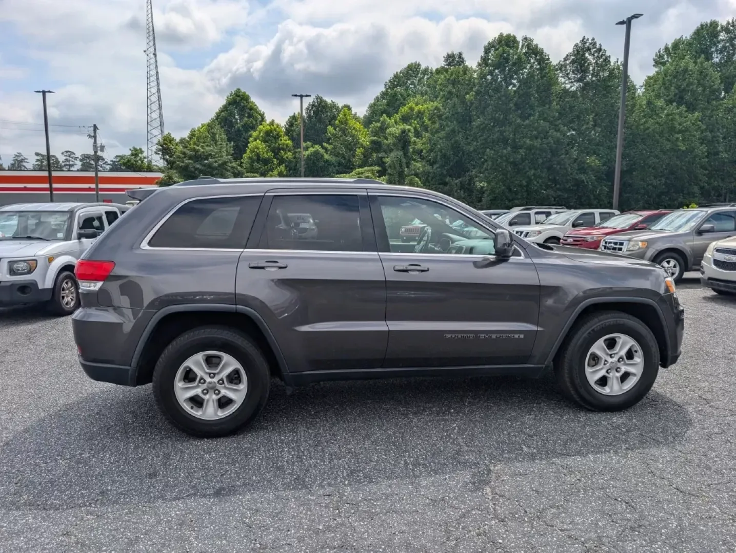 2017 /Black Jeep Grand Cherokee Laredo (1C4RJEAG0HC) with an Other engine, located at 3959 U.S. 80 W, Phenix City, AL, 36870, (334) 297-4885, 32.469296, -85.135185 - Experience the ultimate blend of comfort and capability in this 2017 Jeep Grand Cherokee Laredo, now available at Gils Auto in Phenix City, AL. Whether you're commuting through the bustling streets of downtown, tackling weekend getaways, or embarking on family road trips, this SUV is designed to ele - Photo#3