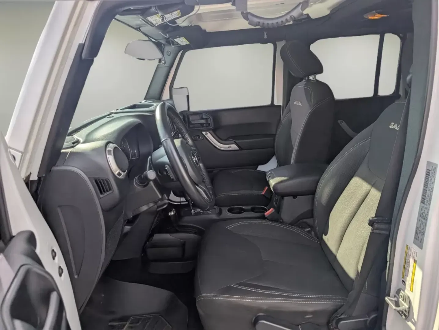 2018 /Black Jeep Wrangler Sahara (1C4BJWEG4JL) with an Other engine, located at 1430 Gateway Drive, Opelika, AL, 36801, (334) 239-0944, 32.637871, -85.409790 - **Adventure Awaits: 2018 Jeep Wrangler Sahara at Gils Auto**<br /> <br /> Are you ready to embark on your next adventure? Whether you're planning a weekend getaway to the stunning landscapes of Lake Martin or navigating through the vibrant streets of Phenix City, this 2018 Jeep Wrangler Sahara is yo - Photo#9