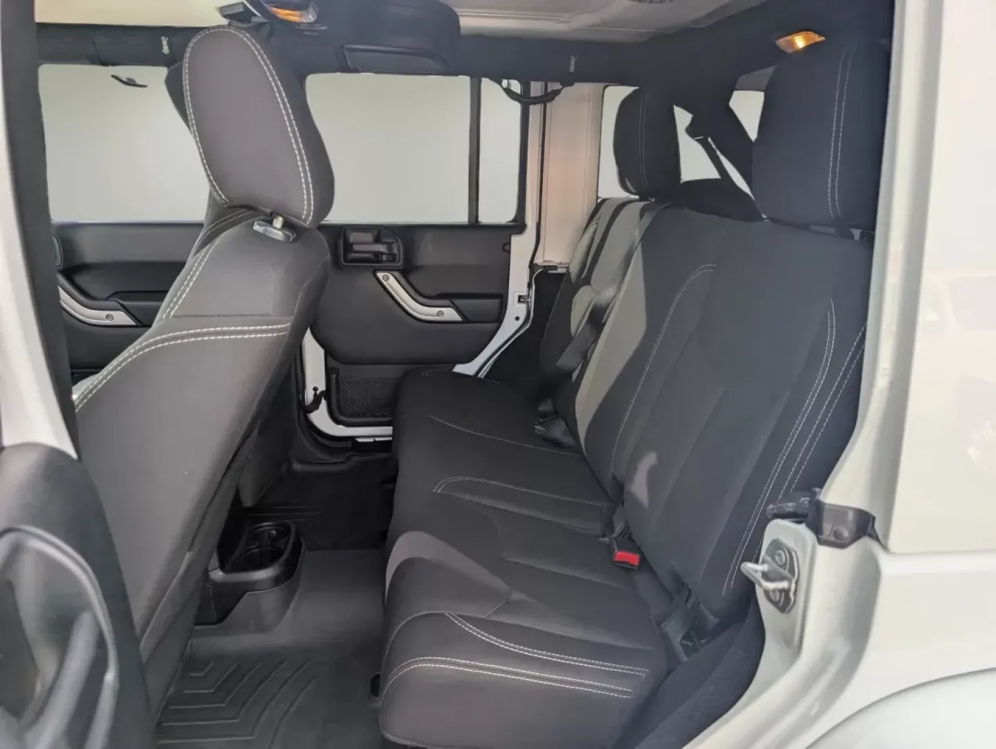 2018 /Black Jeep Wrangler Sahara (1C4BJWEG4JL) with an Other engine, located at 1430 Gateway Drive, Opelika, AL, 36801, (334) 239-0944, 32.637871, -85.409790 - **Adventure Awaits: 2018 Jeep Wrangler Sahara at Gils Auto**<br /> <br /> Are you ready to embark on your next adventure? Whether you're planning a weekend getaway to the stunning landscapes of Lake Martin or navigating through the vibrant streets of Phenix City, this 2018 Jeep Wrangler Sahara is yo - Photo#10